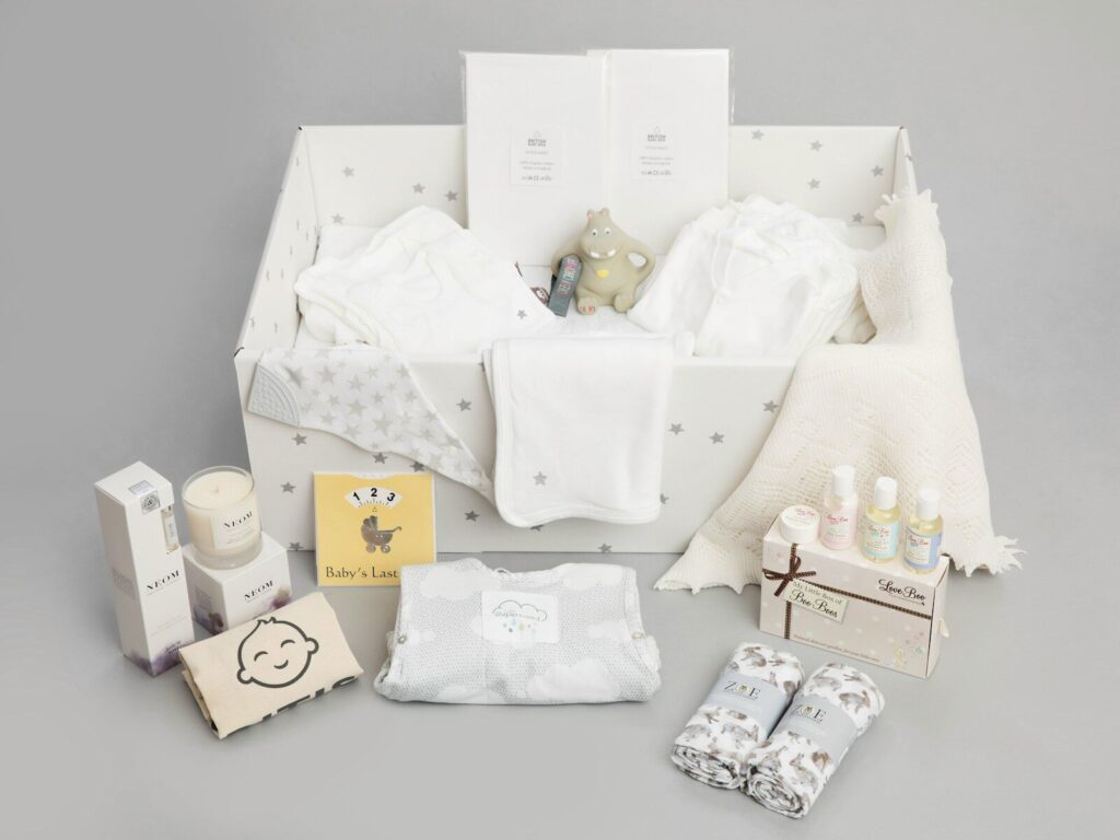 a baby's gift hamper with its contents laid out